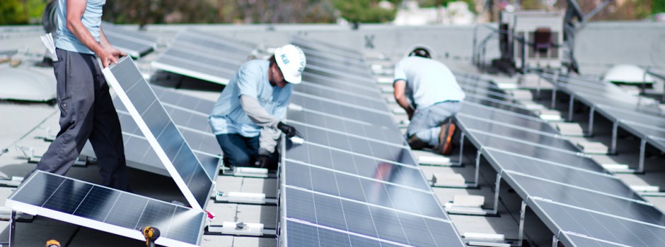 Men installing solar panels